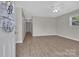 Bright living room with laminate flooring, neutral paint, and ample natural light at 2211 Waverly St, Albemarle, NC 28001