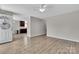 Bright living area with laminate flooring, neutral paint, and an open layout at 2211 Waverly St, Albemarle, NC 28001