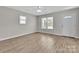 Inviting living room features wood-look floors and ample natural light at 2211 Waverly St, Albemarle, NC 28001