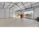 Bright and spacious interior of an outbuilding with two roll up garage doors at 2211 Waverly St, Albemarle, NC 28001