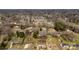 Neighborhood aerial view featuring modest homes with tree coverage at 2232 Glenraven Ave, Gastonia, NC 28052