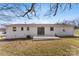 Backyard of the property featuring a painted brick home and concrete patio at 2232 Glenraven Ave, Gastonia, NC 28052