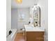 Bathroom with new vanity and countertop, brass faucet, globe light fixture and subway tile at 2232 Glenraven Ave, Gastonia, NC 28052