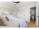 Bedroom showcasing neutral tones, ample lighting and an attached ensuite bathroom at 2232 Glenraven Ave, Gastonia, NC 28052