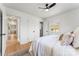 Bright bedroom with a ceiling fan, white walls, and wood-look floors at 2232 Glenraven Ave, Gastonia, NC 28052