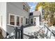 Wooden back deck offering outdoor living space and featuring multiple windows and access points to the home at 2320 Christensens Ct, Charlotte, NC 28270