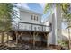 Picture of the back of the house showing a wooden deck with stairs going down to the backyard at 2320 Christensens Ct, Charlotte, NC 28270