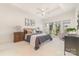 Spacious bedroom featuring a tray ceiling, neutral color palette, and large window with natural light at 2320 Christensens Ct, Charlotte, NC 28270