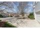 Street view showing homes with mature trees and landscaping along well maintained sidewalks at 2320 Christensens Ct, Charlotte, NC 28270