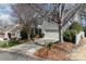 Well-maintained home with a two-car garage, neat landscaping, and mature trees enhance curb appeal at 2320 Christensens Ct, Charlotte, NC 28270