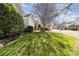 Street view showing lush green lawns, landscaping, and well-maintained homes in a residential neighborhood at 2320 Christensens Ct, Charlotte, NC 28270