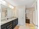 En-suite bathroom with double sink vanity, granite countertops, and a separate shower at 2437 Grinstead Ct, Clover, SC 29710