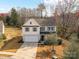 Charming two-story home with a well-manicured lawn and a driveway leading to an attached garage at 2437 Grinstead Ct, Clover, SC 29710