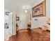 Traditional foyer with hardwood floors, elegant console table and a decorative painting at 2437 Grinstead Ct, Clover, SC 29710