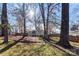 Expansive backyard view with mature trees and well-maintained lawn, ideal for outdoor activities and enjoyment at 2500 Danforth Ln, Charlotte, NC 28208