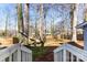 Spacious backyard featuring mature trees, a hammock, and privacy fencing, offering a peaceful outdoor retreat at 2500 Danforth Ln, Charlotte, NC 28208