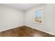 This bedroom features hardwood floors and a window at 2500 Danforth Ln, Charlotte, NC 28208