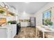 Well-lit kitchen with stainless steel appliances, white cabinetry, and modern finishes at 2500 Danforth Ln, Charlotte, NC 28208