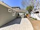 Backyard featuring stamped concrete patio and fenced yard with professional landscaping at 2919 Park Rd, Charlotte, NC 28209