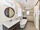 Beautiful bathroom with freestanding tub, dual vanities, and tiled shower with glass door at 2919 Park Rd, Charlotte, NC 28209