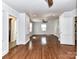 This bedroom features hardwood floors, neutral walls, and ensuite bathroom at 2919 Park Rd, Charlotte, NC 28209