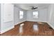 This bedroom features hardwood floors, neutral walls, and ceiling fan at 2919 Park Rd, Charlotte, NC 28209