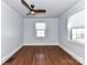 Empty bedroom features hardwood floors, neutral walls, and ample natural light at 2919 Park Rd, Charlotte, NC 28209