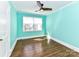 Bright bedroom featuring hardwood floors, modern ceiling fan, and great natural light at 2919 Park Rd, Charlotte, NC 28209