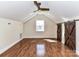 Bedroom featuring hardwood floors, window, and rustic sliding barn doors at 2919 Park Rd, Charlotte, NC 28209