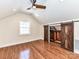 Bonus room with hardwood floors, window, and rustic sliding barn doors at 2919 Park Rd, Charlotte, NC 28209