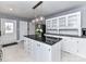 Bright kitchen features a center island with pendant lighting and ample cabinet space at 2919 Park Rd, Charlotte, NC 28209