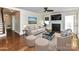 Staged living room featuring a fireplace, hardwood floors and ample space at 2919 Park Rd, Charlotte, NC 28209