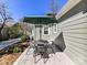 Outdoor patio featuring a stone tile floor, metal table and chairs, and a large shade umbrella at 2919 Park Rd, Charlotte, NC 28209