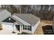 Aerial view of a one-story home with an attached garage in a residential neighborhood at 3122 Maple Ridge Dr, Gastonia, NC 28052