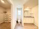 A bright bathroom with a granite countertop vanity, white cabinets, and luxury vinyl flooring at 3122 Maple Ridge Dr, Gastonia, NC 28052