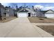 Traditional single-Gathering home featuring a two-car garage and well-maintained lawn at 3122 Maple Ridge Dr, Gastonia, NC 28052