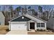 Charming single-story home with attached two-car garage and landscaped front yard at 3122 Maple Ridge Dr, Gastonia, NC 28052