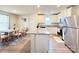 Well-lit kitchen featuring stainless steel appliances, granite countertops, and an adjacent dining area at 3122 Maple Ridge Dr, Gastonia, NC 28052