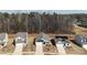 An aerial view showcases three single-Gathering homes on a tree-lined street, offering curb appeal in a residential neighborhood at 3122 Maple Ridge Dr, Gastonia, NC 28052