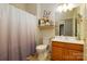 Well-maintained bathroom features a shower/tub combo and wooden vanity with ample counter space at 313 Garner Dr, Salisbury, NC 28146