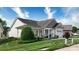 Well-maintained home with manicured lawn, front porch seating, and charming architectural details at 313 Garner Dr, Salisbury, NC 28146
