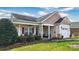 Charming single-story home with a welcoming front porch and well-maintained landscaping at 313 Garner Dr, Salisbury, NC 28146