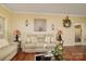 Cozy living room featuring comfortable seating and decorative wall art and wood floors at 313 Garner Dr, Salisbury, NC 28146