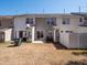 Townhome backyard with small concrete patio, fenced in space, and grass at 3209 Blythe Ridge Ct, Charlotte, NC 28213