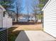 Fenced backyard with concrete patio and sparse grass; townhomes visible in background at 3209 Blythe Ridge Ct, Charlotte, NC 28213