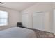 Bedroom featuring bright light from a window and double closets for ample storage at 3209 Blythe Ridge Ct, Charlotte, NC 28213