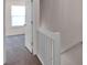 Upstairs hallway with carpeted floors and white banister at 3209 Blythe Ridge Ct, Charlotte, NC 28213