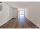 Bright, open living room with hardwood floors, leading to the dining area and kitchen at 3209 Blythe Ridge Ct, Charlotte, NC 28213