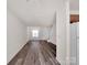 Expansive living room featuring hardwood floors and easy access to the kitchen and stairs at 3209 Blythe Ridge Ct, Charlotte, NC 28213