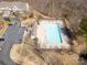 Overhead shot of a community pool showcasing seating, clubhouse, trees, and parking at 3209 Blythe Ridge Ct, Charlotte, NC 28213